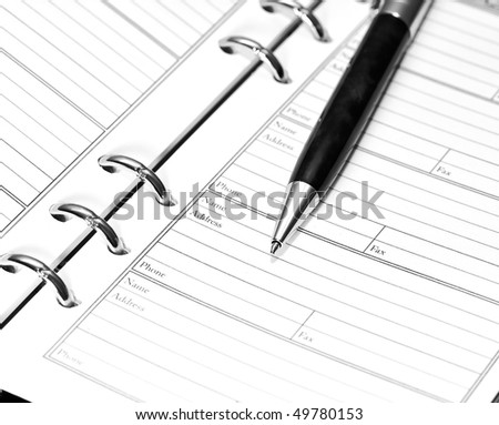 pen on notebook. close up shoot