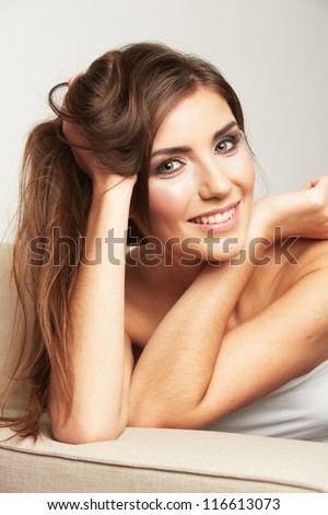 Close up portrait of beautiful young woman face. Isolated on white background. Portrait of a female model. disheveled Hair style