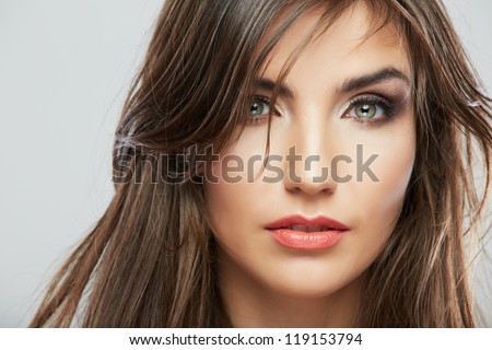 Woman face with hair motion on white background isolated close up portrait.