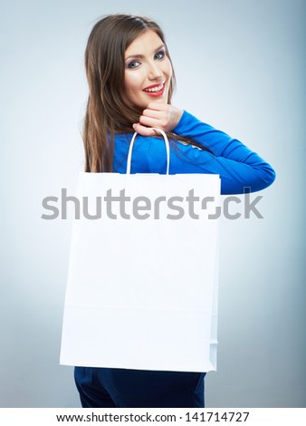 Portrait of happy smiling woman hold shopping bag. Female model isolated studio background.