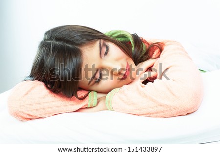 Beautiful young woman sleep in bed. Smiling girl close up portrait.