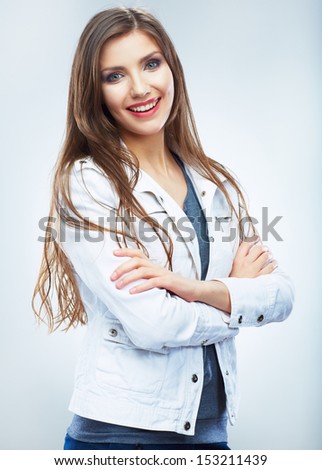 Casual style young woman posing on isolated studio background. Beautiful girl portrait. Female model poses.