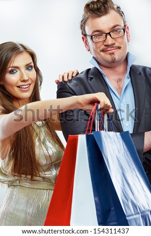 Man, woman couple shopping portrait. Shopping bags. White background.