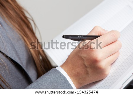 Business paper, sign a contract. Isolated female model part.