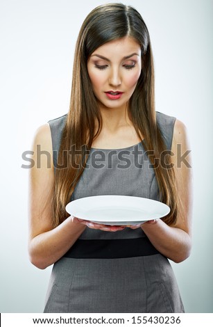 portrait of business woman hold empty white plate. Business concept portrait.