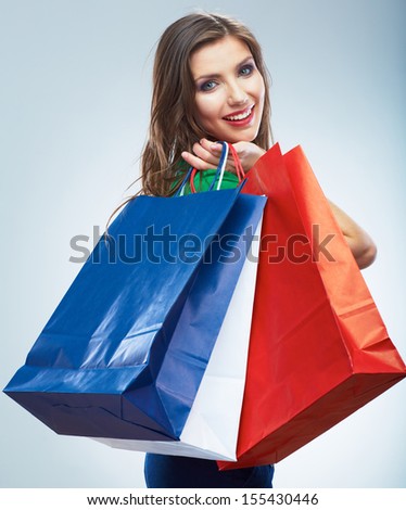 Portrait of happy smiling woman hold shopping bag. Female model isolated studio background.