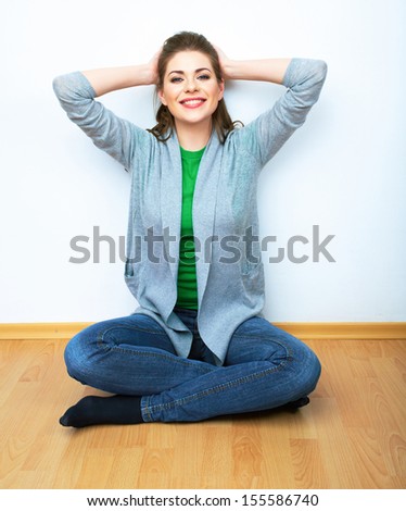 Woman natural portrait,  yoga exercises at home. White background. wooden floor.
