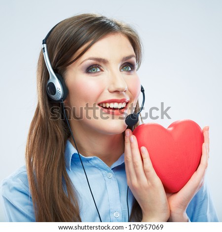 Woman call center operator hold love symbol Red heart. Close up business woman portrait.