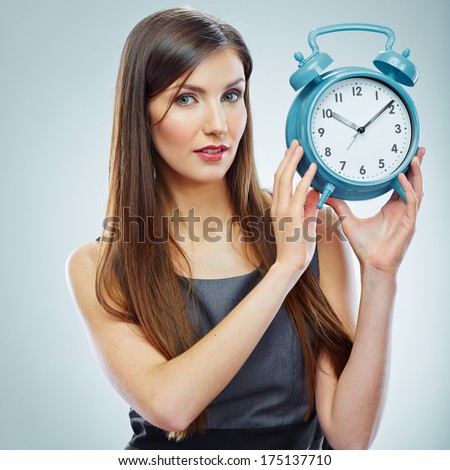 Portrait of business woman holding watch. Business time concept.