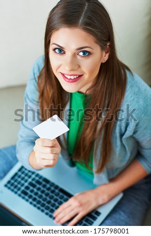 Woman, laptop. credit card. Shopping on couch. Female model.