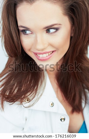 Beautiful smiling woman with long brown hair, isolated white background portrait.