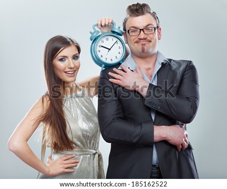Business woman and business man hold watch. Time concept.