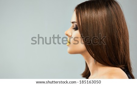 Profile portrait of young beautiful woman with straight hair.
