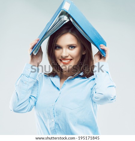 Funny office worker girl posing with paper folder on head.