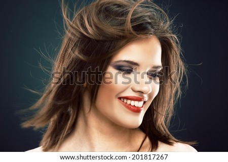 Hair style smiling woman portrait. Female model with long hair in motion.