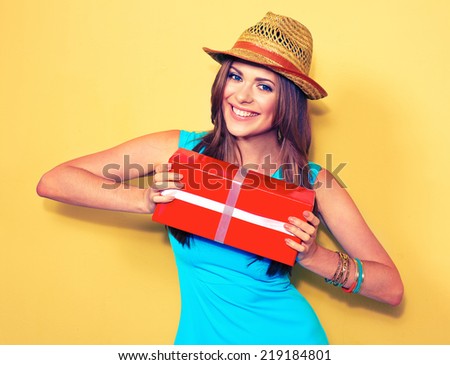 fashion model posing with gift box. woman portrait. long hair .