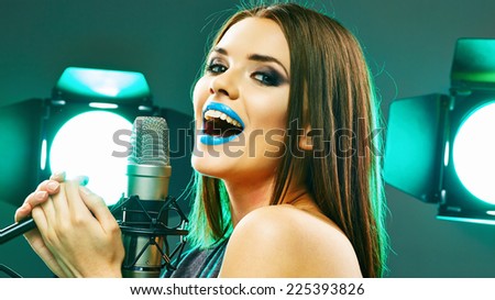 Model rock star singer. Sound studio music concept.