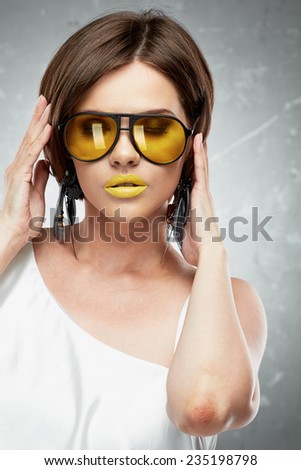 Beauty face portrait of sexy model with yellow sun glasses. Face. Beautiful model.