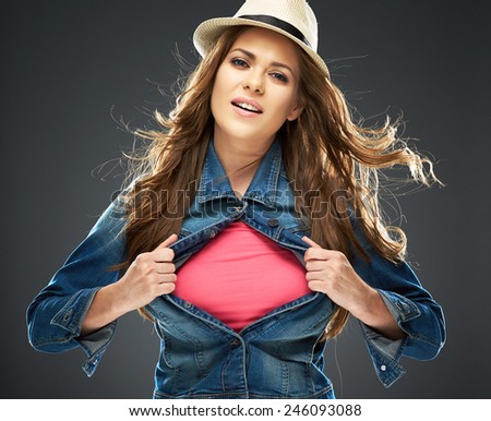 smiling woman with long hair ripping his clothes. copy space for advertising sign.