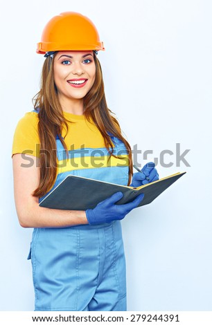 Engineer woman smile, hold business paper. Builder uniform coveralls. Isolated studio portrait. Orange protective helmet.
