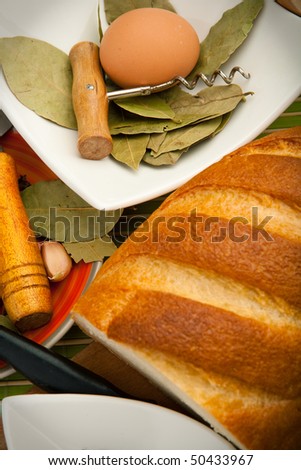 Various kitchen utensils are on the bamboo cloth