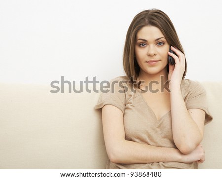 smiling woman speaks by phone