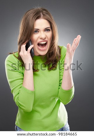 angry woman shouts in phone. Negative emotions on a face