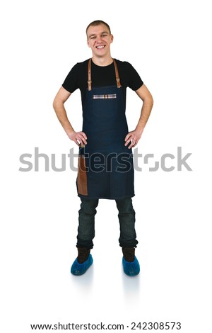 A shoot of young caucasian men in apron as a barmen with arms akimbo. Isolated against white background.