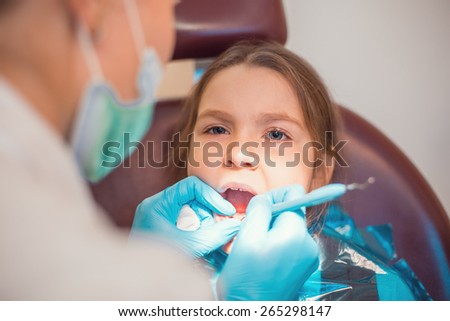 Little cute caucasian girl during visit in dental office