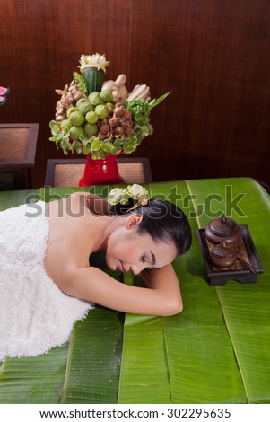 Portrait of a pretty woman enjoying a  massage at the health spa