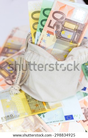 euro money in pouch on euro background