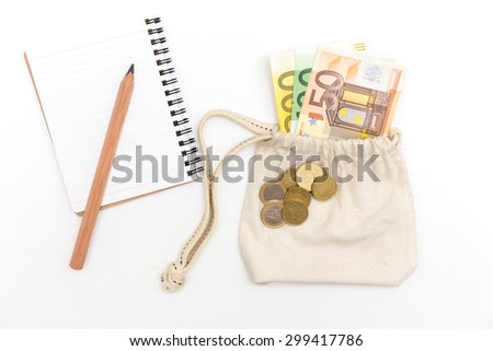 money bag and notebook on white  background
