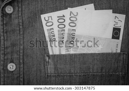 black and white euro bank note in jeans shirt pocket