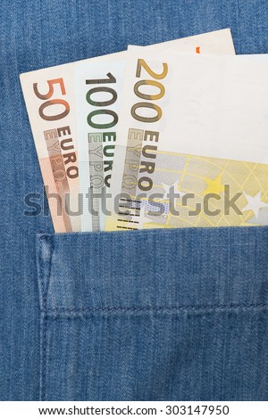 euro bank note in jeans shirt pocket