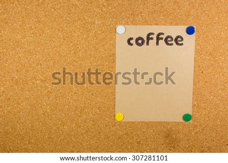 coffee word on paper on cork board with sticky note pinned