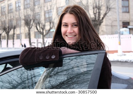 Young woman in the car, winter