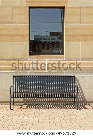 Solitary bench under window