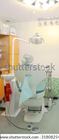Modern dentist\'s chair in a medical room.