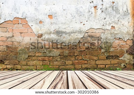 Old brick wall and wood floor.