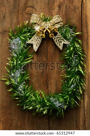 Christmas wreath on the old wooden door