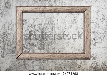 blank photo frame on old wall