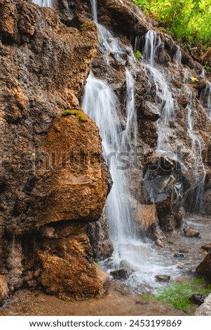 Similar – Foto Bild Wunderschöner Wasserfall in felsiger Schlucht