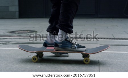 Similar – Image, Stock Photo Unrecognizable skater riding board near modern building