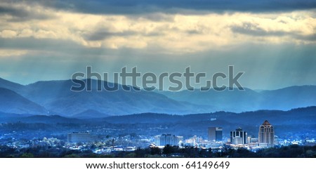Sunbeams on the city- The sun cuts through the clouds over the city of Roanoke, VA