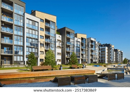 Similar – Foto Bild Fassade eines Wohnhaus in Beige und Naturfarben im Licht der Abendsonne am Abend im Stadtteil Bornheim in Frankfurt am Main in Hessen