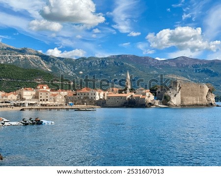 Similar – Image, Stock Photo Old town with white houses and stone ruins at sunset