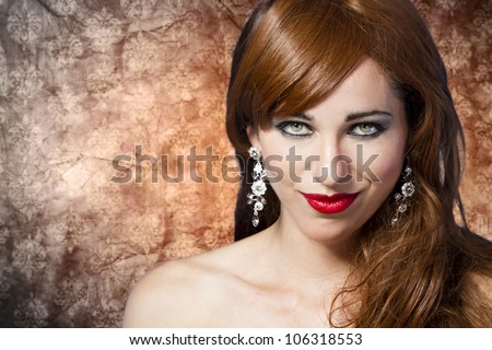 Picture of a beautiful woman with red hair wearing beautiful jewelry