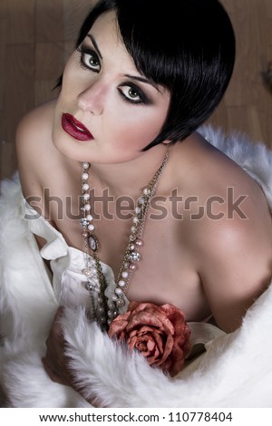 20s style beautiful brunette female wearing fur, exquisite, showing bare shoulders, candor