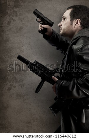 Dangerous man armed with a pistol and machine gun