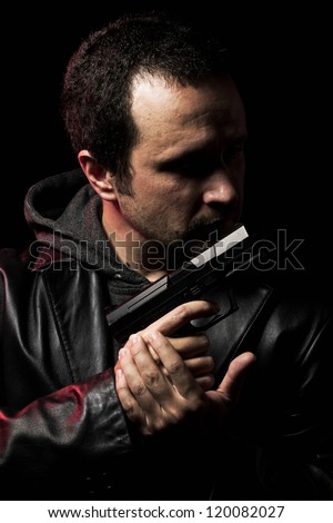Robber with gun. Man in suit draws vintage handgun